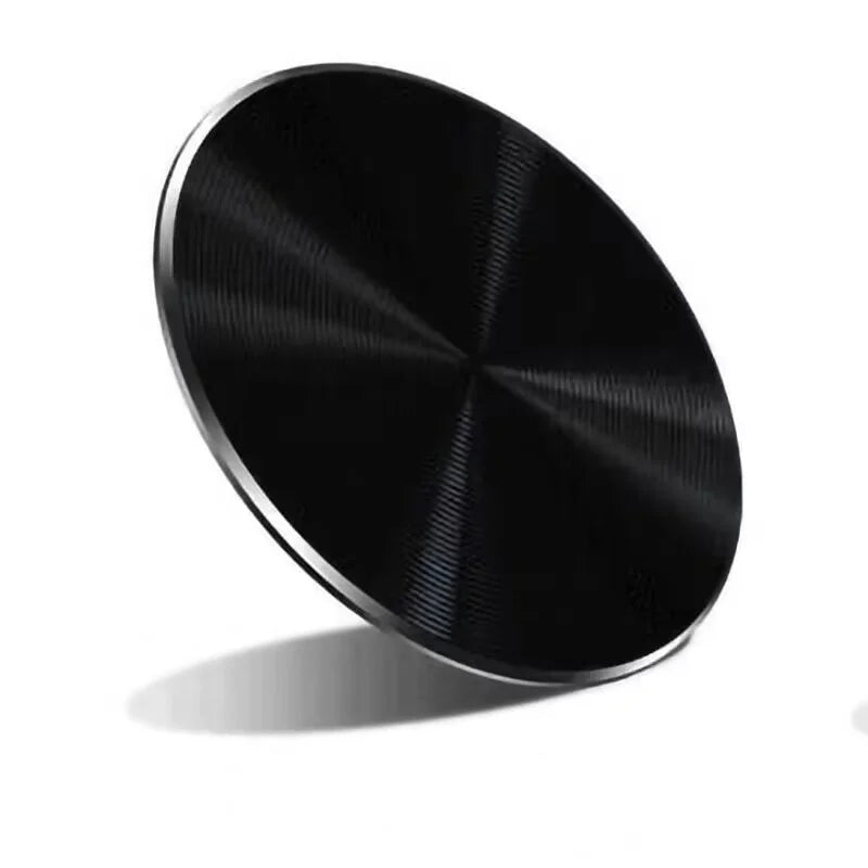 A sleek, black circular wireless charging pad with a metallic, brushed finish and thin silver edge.