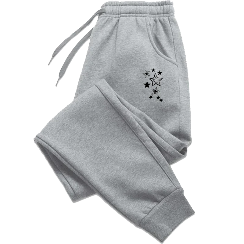 Grey fleece joggers with drawstring waist, cuffed ankles, and a black star print on the hip.