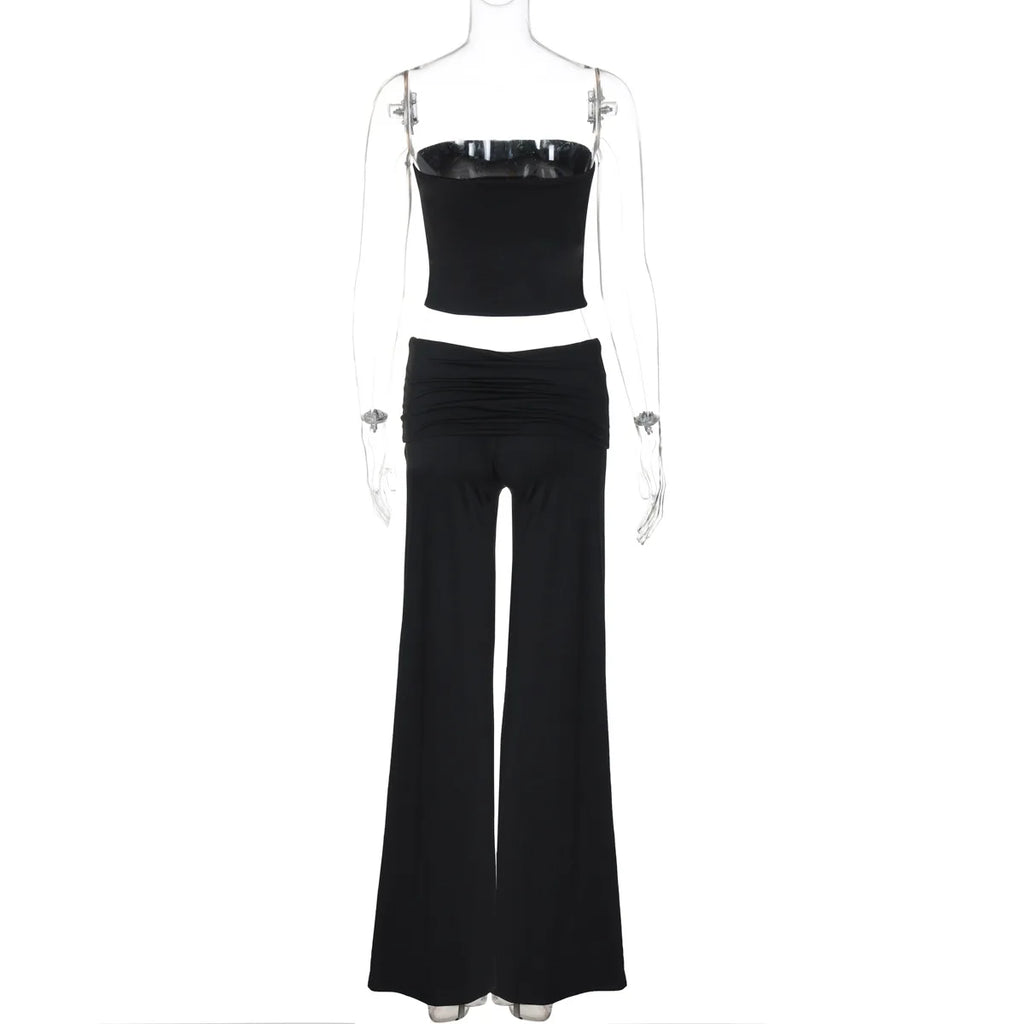 Black two-piece set featuring a strapless crop top and wide-leg trousers with a ruched waistband on a mannequin.