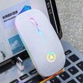 Sleek, white wireless ergonomic mouse with vibrant RGB lighting and a glowing play icon on a laptop keyboard.