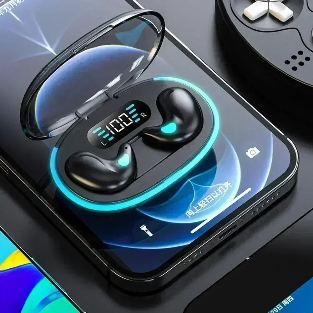 Black wireless earbuds in a glowing, open charging case with a digital battery display, sitting on a smartphone.