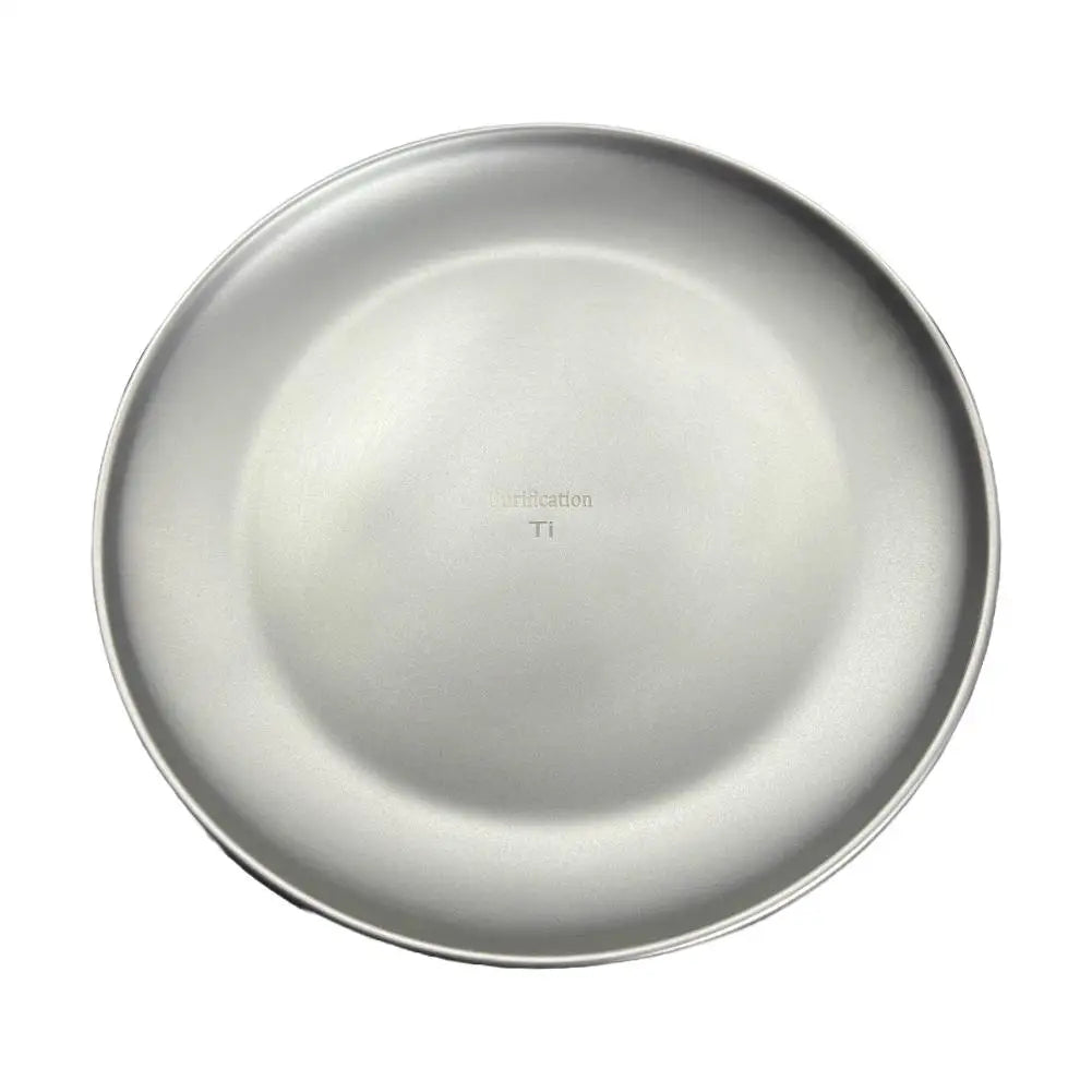 Round gray titanium plate viewed from above, with the text "Purification Ti" engraved in the center.
