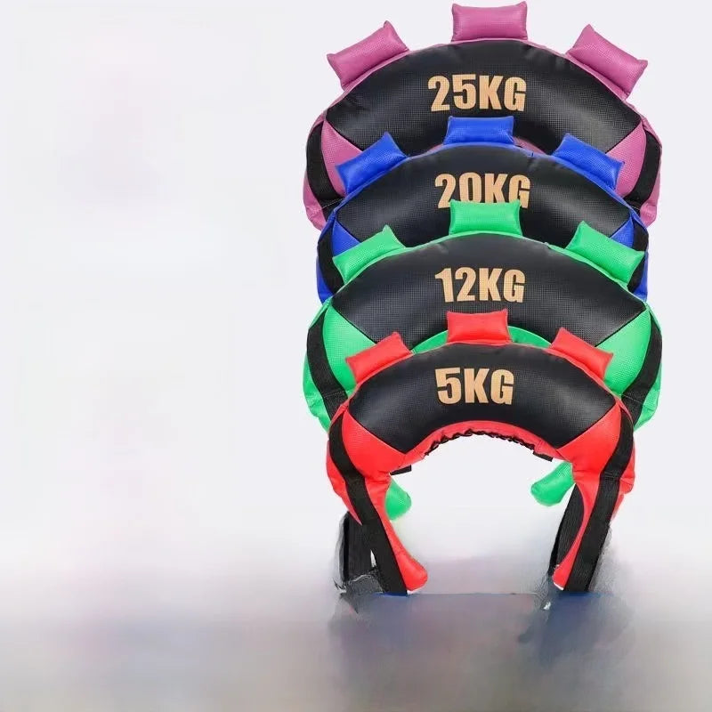 A stack of four crescent-shaped weighted Bulgarian fitness bags in black with red, green, blue, and pink accents.