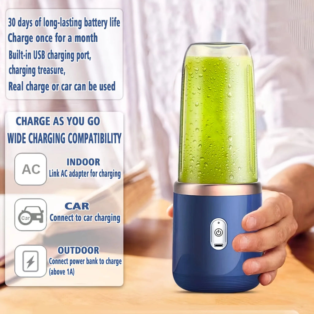 Portable blue personal blender with a clear cup containing a green smoothie, held in a hand. USB rechargeable design.