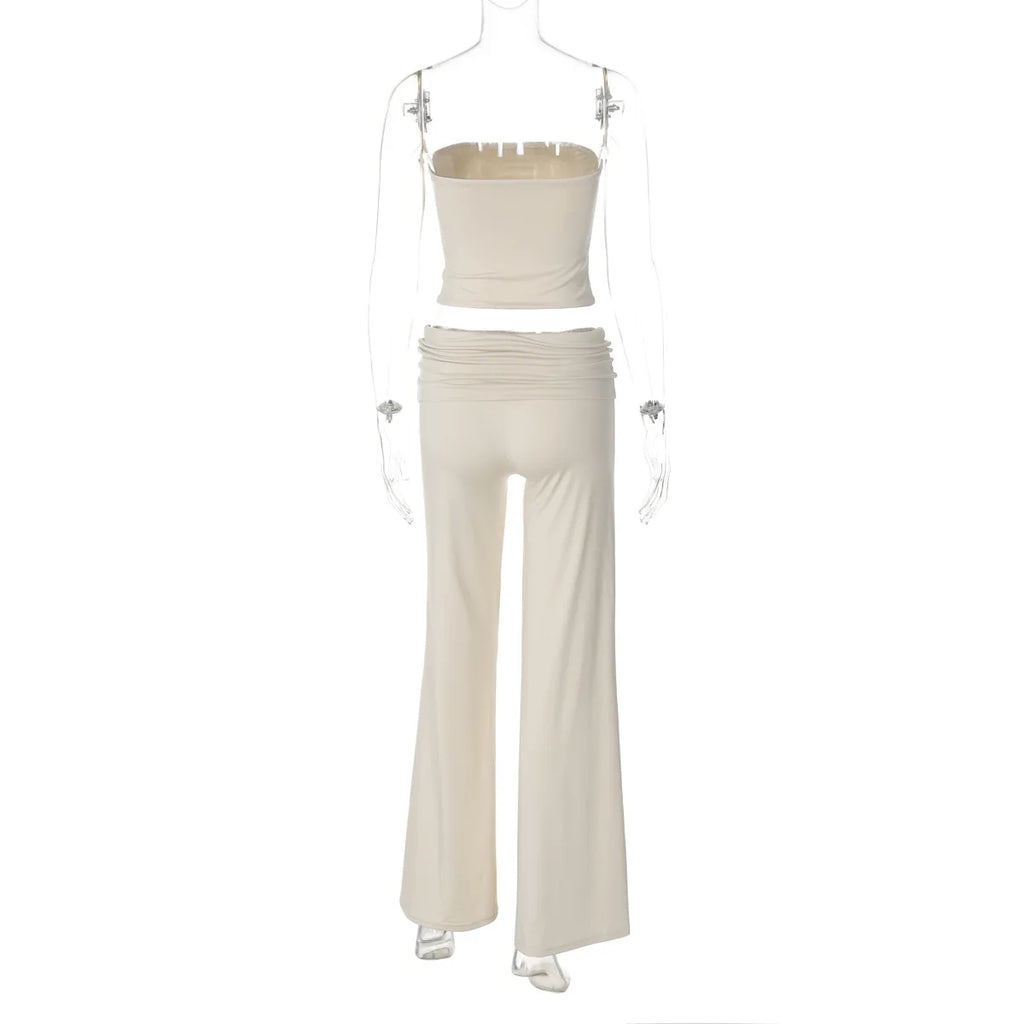 Cream two-piece set featuring a strapless crop top and high-waisted wide-leg trousers on a mannequin.