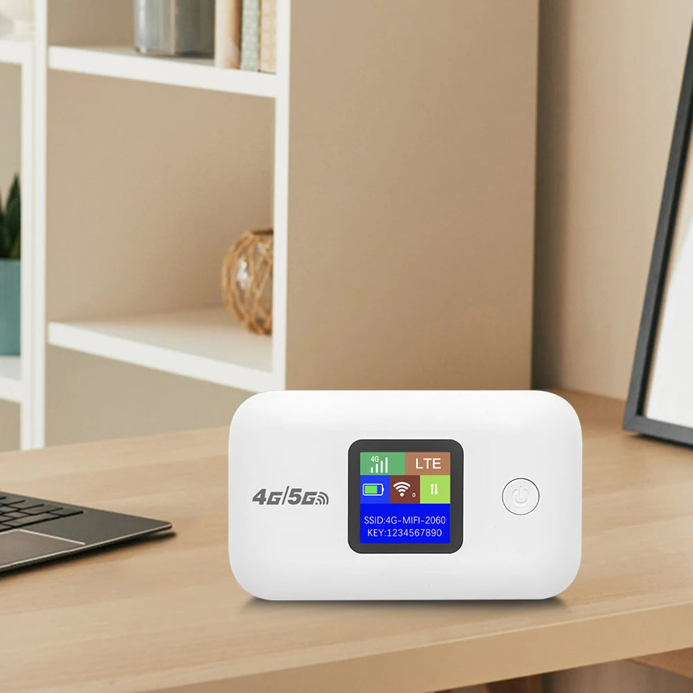 White portable 4G LTE WiFi hotspot router with a digital status display screen, set on a wooden desk.