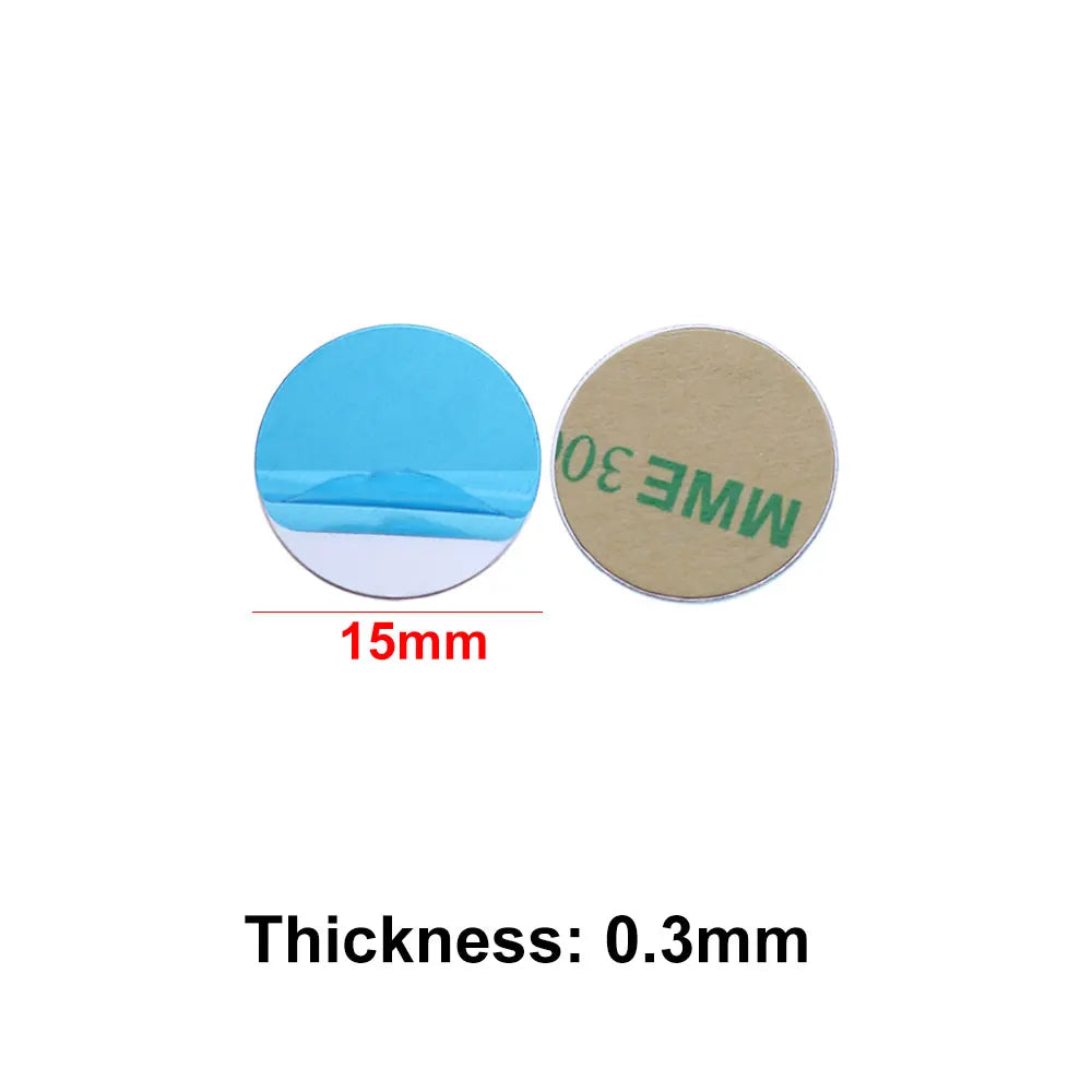 Two circular, 15mm-wide adhesive pads: one with a blue peel-off backing and one with a tan adhesive side.
