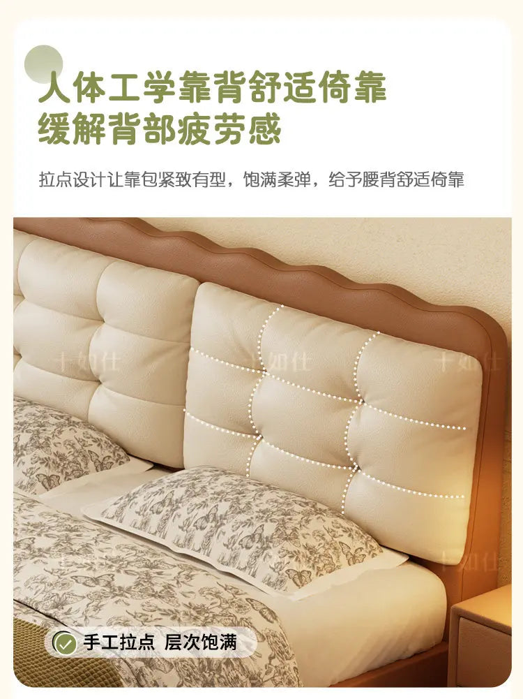 Modern platform bed with a cream-coloured, button-tufted upholstered headboard and a warm brown scalloped frame.