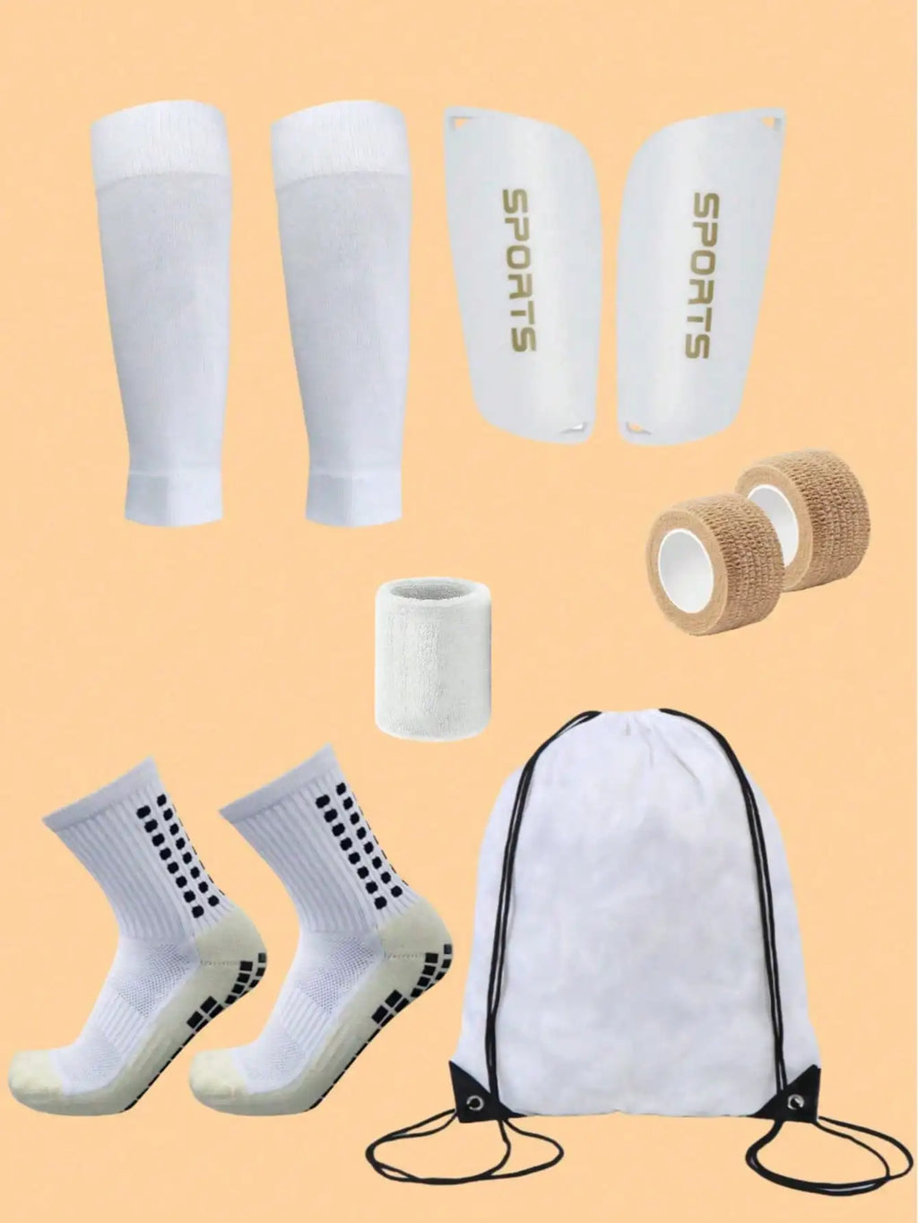 White football kit set including shin guards, grip socks, sleeves, wristband, adhesive bandages, and a drawstring bag.