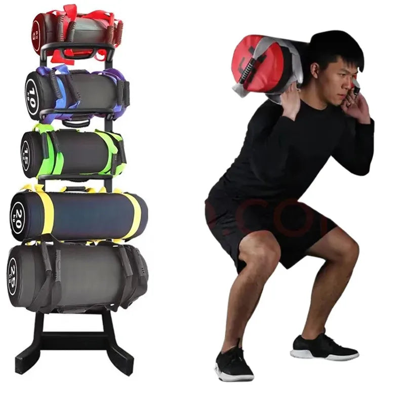 Black fitness energy power bags with colored straps on a vertical rack, and a man squatting with a red bag.