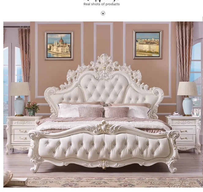 Luxury cream-white princess bed with an ornate, button-tufted headboard, carved wooden frame, and matching nightstands.
