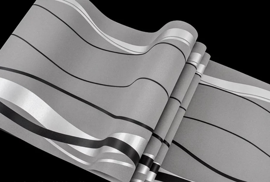 Modern grey wallpaper roll featuring elegant, flowing geometric stripes in black and white tones.