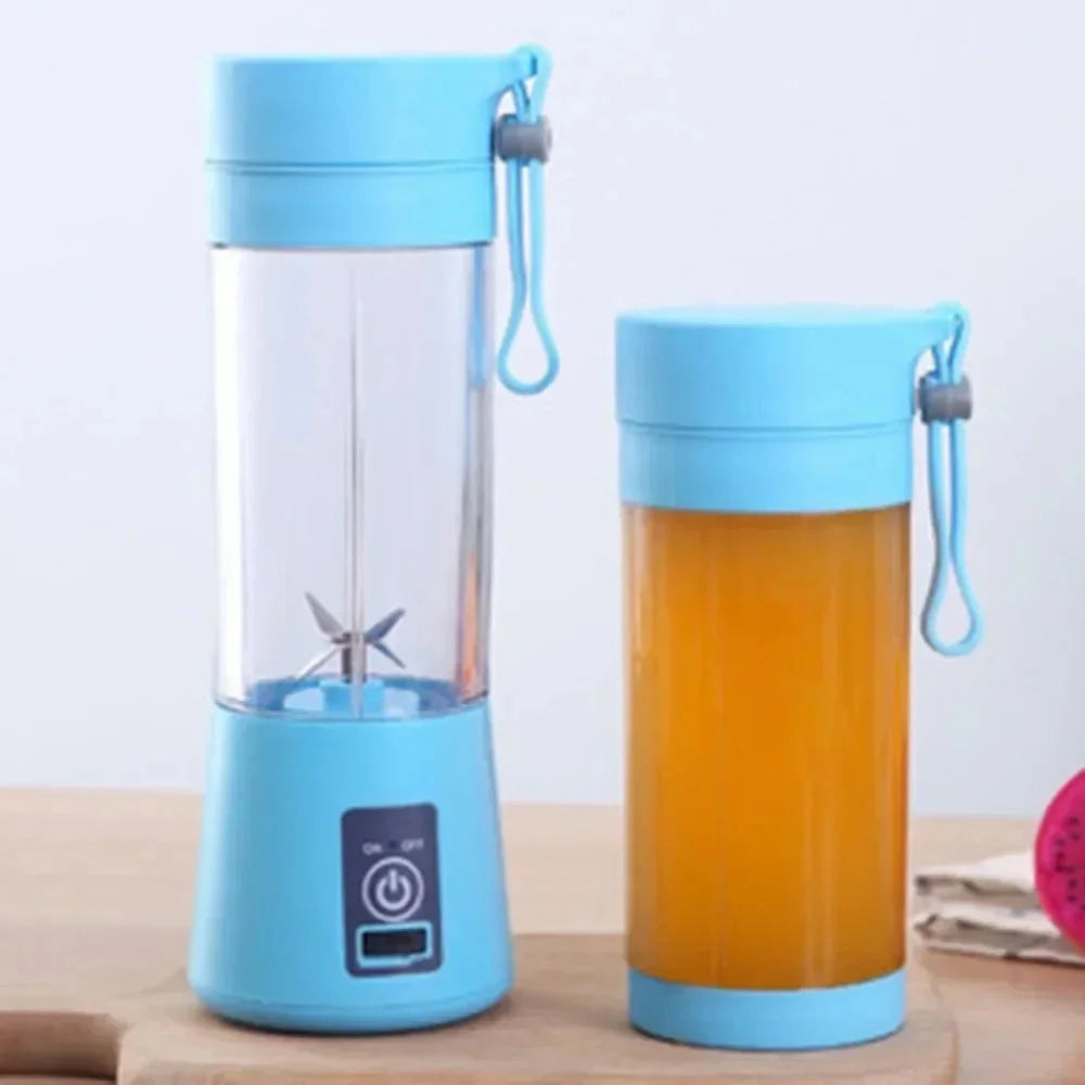 Two light blue portable electric blenders with a clear plastic cup and a carry strap, one filled with orange juice.