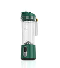 Portable dark green blender with clear cup, measurement markings, and digital power display.