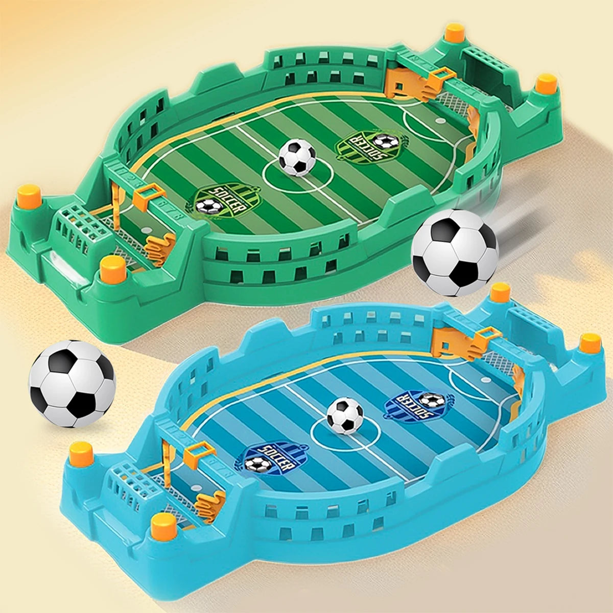 Two plastic tabletop football games in green and blue, featuring goals, striped pitches, and small footballs.