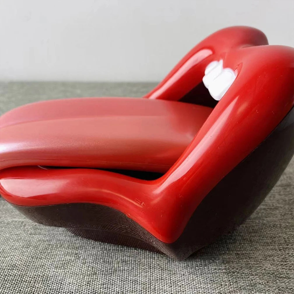 Glossy red lips-shaped novelty storage box or trinket dish with a protruding tongue.