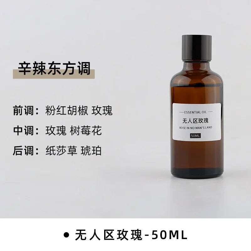 50ml amber glass bottle of rose-scented essential oil with a minimalist white label, isolated on a white background.