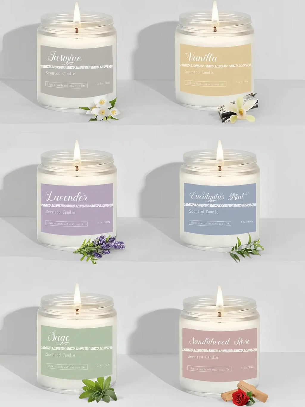 Six scented candles in glass jars with pastel labels and botanical accents, each with a lit wick.