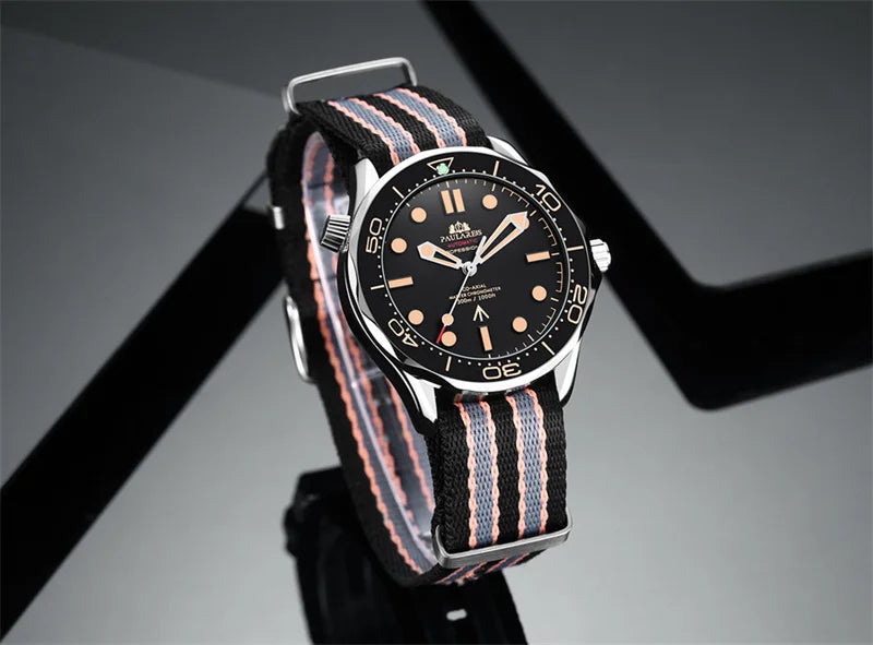 Classic men's automatic stainless steel watch with a black dial and a striped black, grey and pink fabric strap.