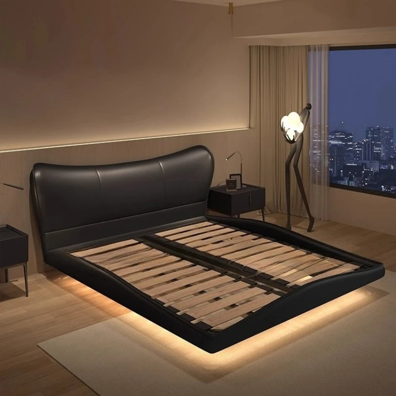 Modern black upholstered bed frame with a curved headboard and integrated LED under-bed lighting.