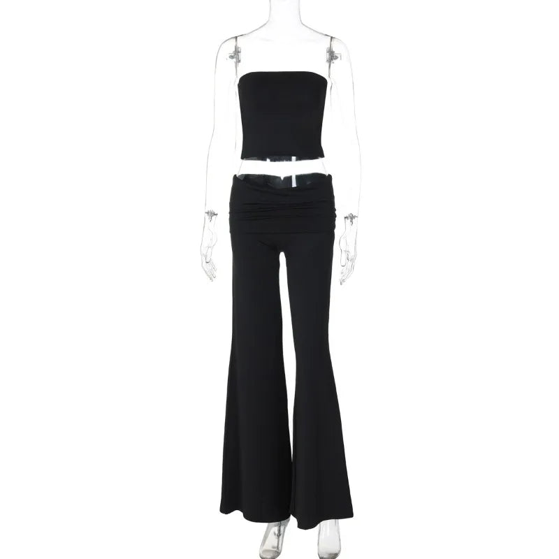 Black two-piece set featuring a strapless crop top and high-waisted, wide-leg flared trousers on a mannequin.
