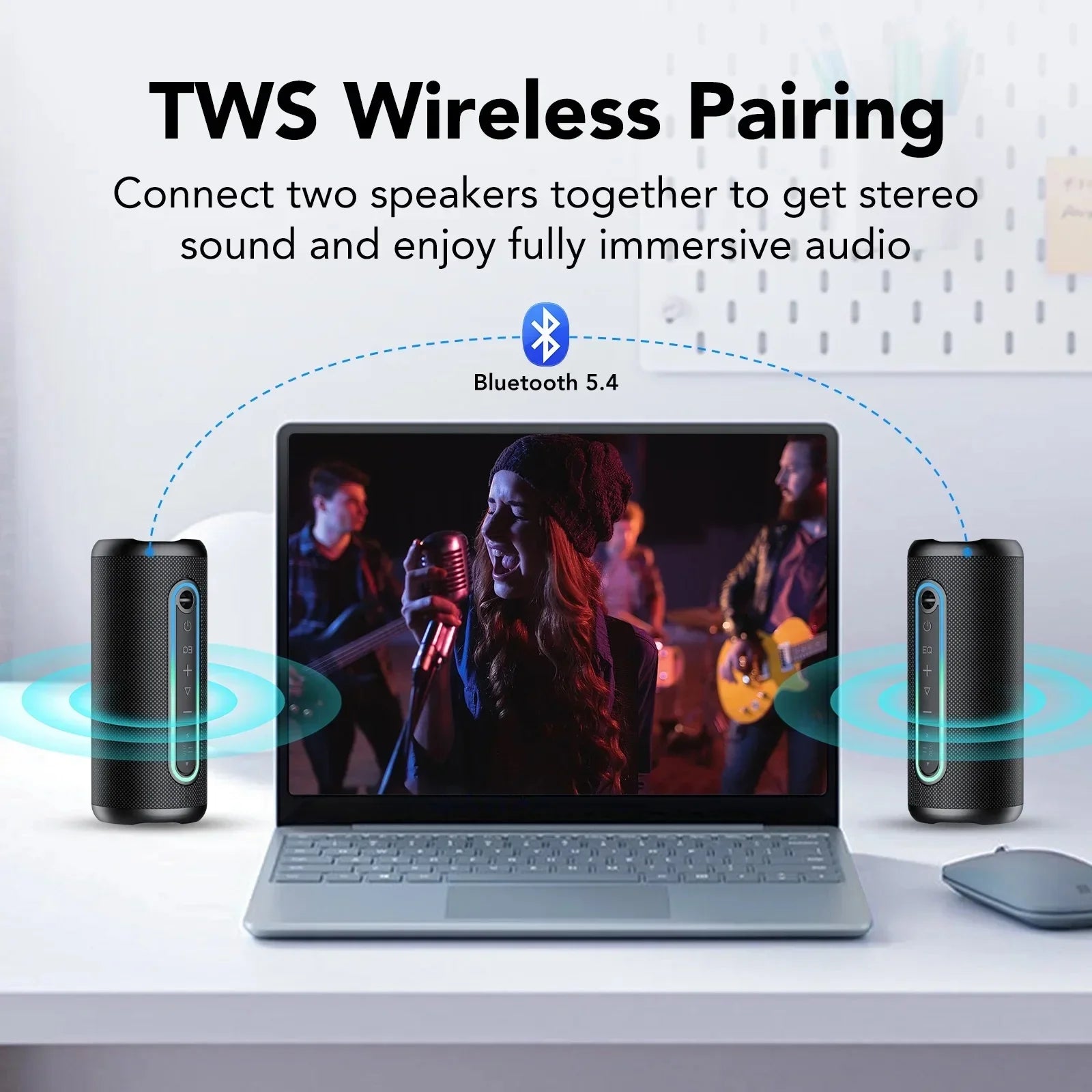 Two black portable Bluetooth speakers with glowing LED strips, wirelessly connected to a laptop for stereo sound.