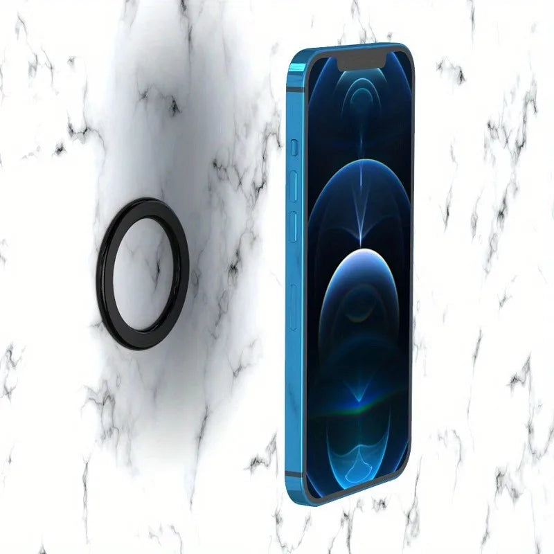 Blue smartphone magnetically attached to a black ring mount against a white marble-patterned background.