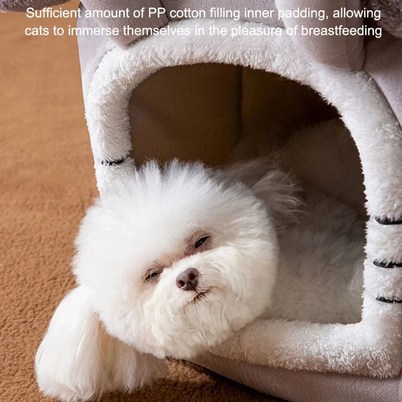 Fluffy white dog resting inside a gray and white cave-style pet bed with plush trim.