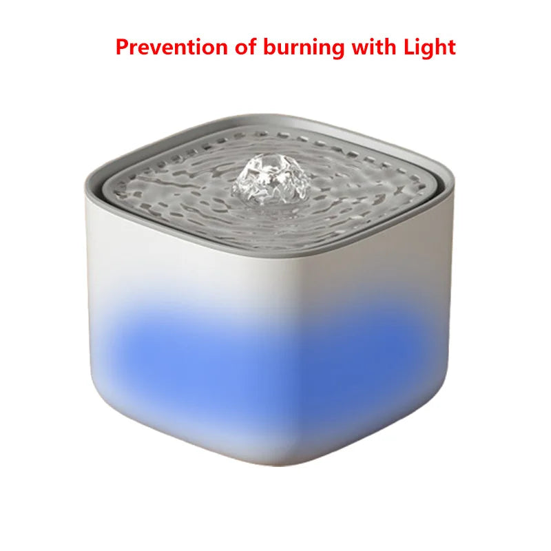 Square white pet water fountain with a grey top and an internal blue LED light glowing through the base.