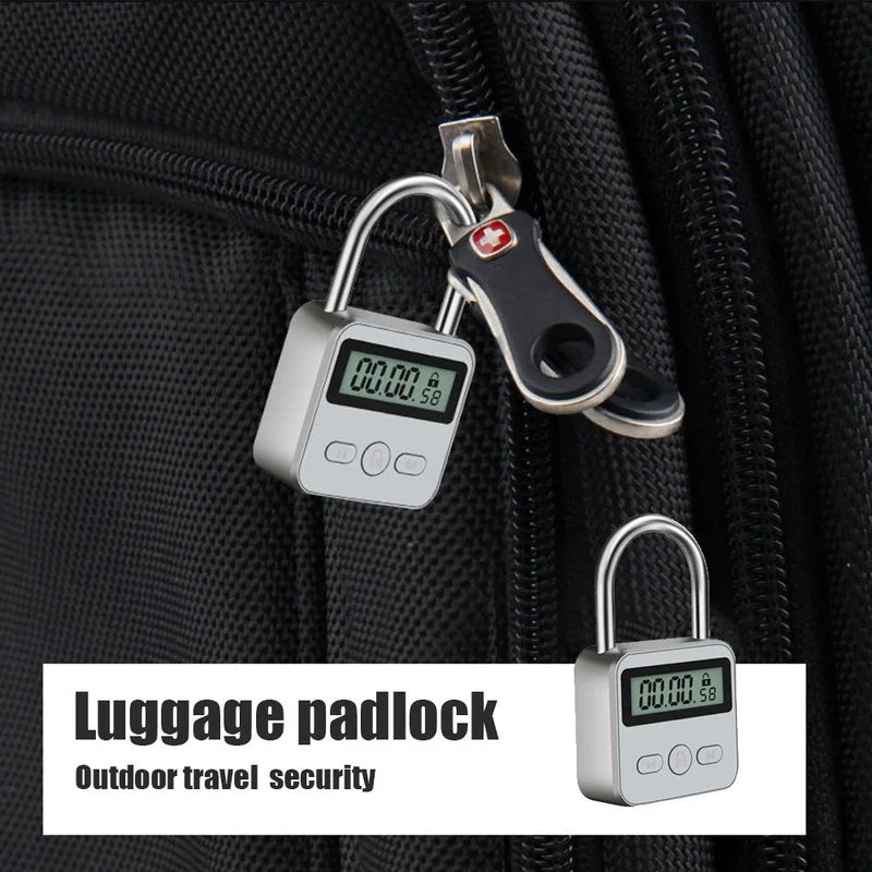 Silver metal digital luggage padlock with an LCD timer screen, attached to a black fabric suitcase zipper.