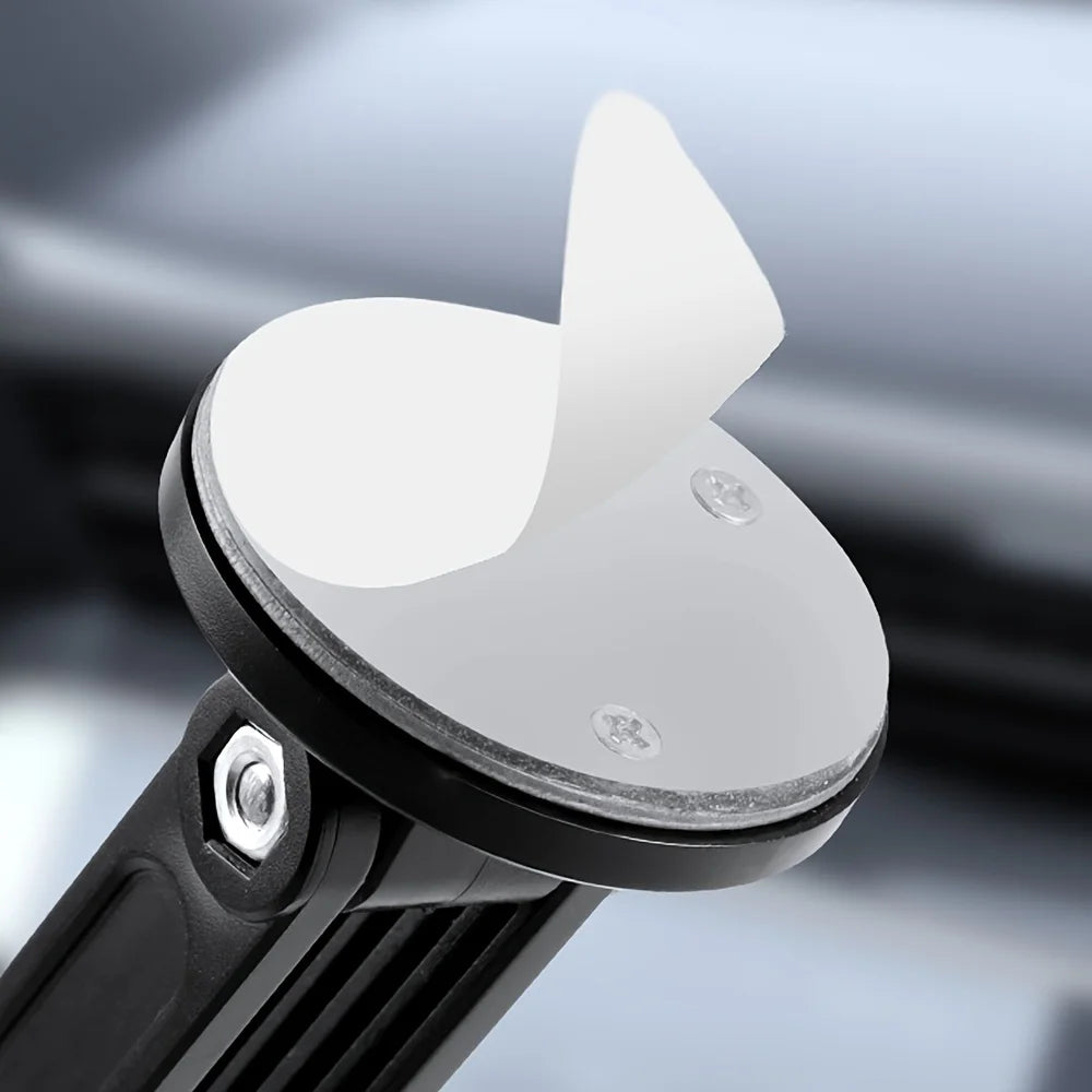 Black adjustable car mount base with a circular adhesive pad featuring a peeling white protective cover.