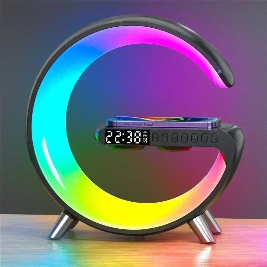 C-shaped black wireless charging stand with a rainbow LED light, digital alarm clock, and built-in speaker.