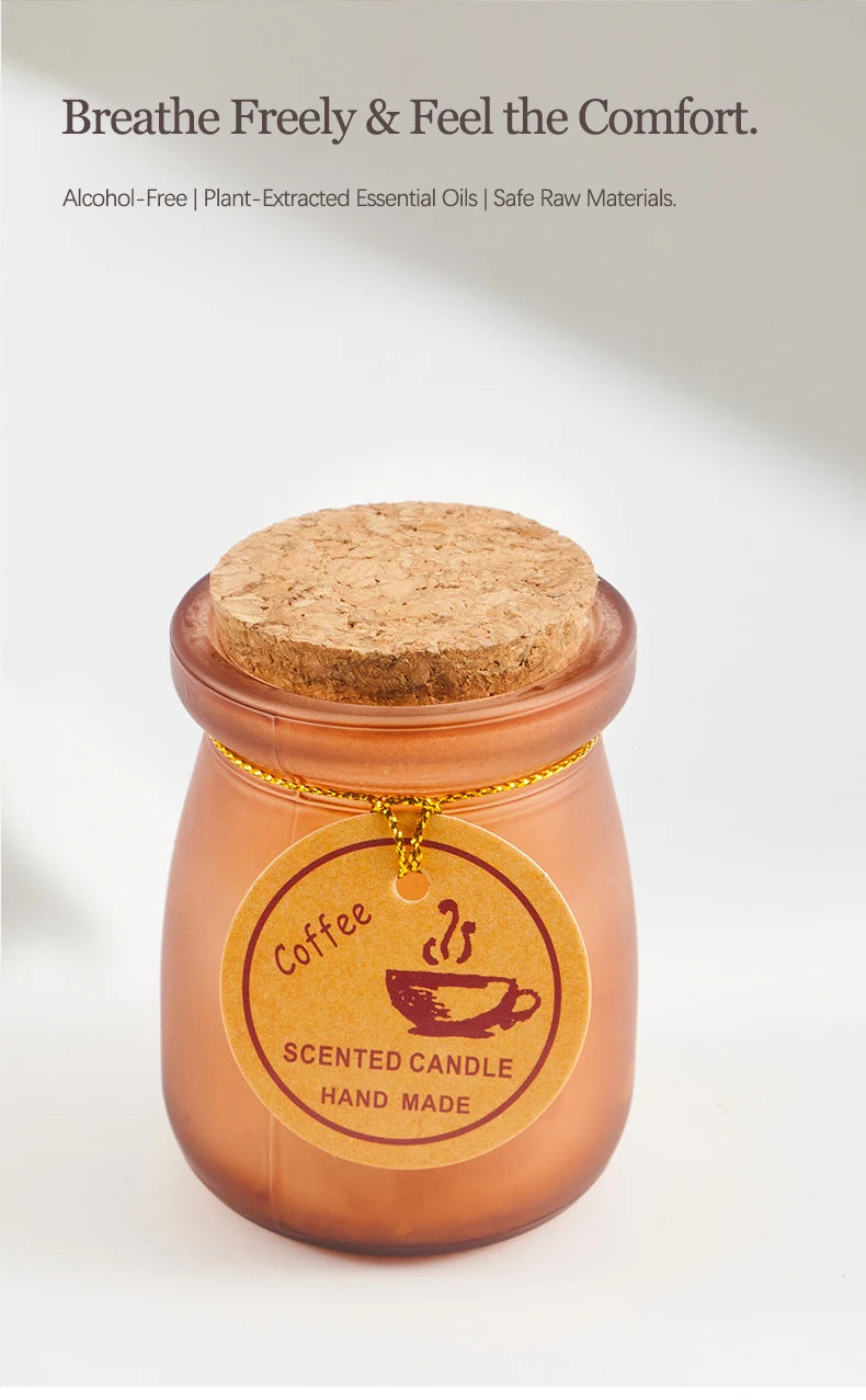 Handmade coffee-scented candle in a frosted brown glass jar with a round cork lid and a rustic paper tag.