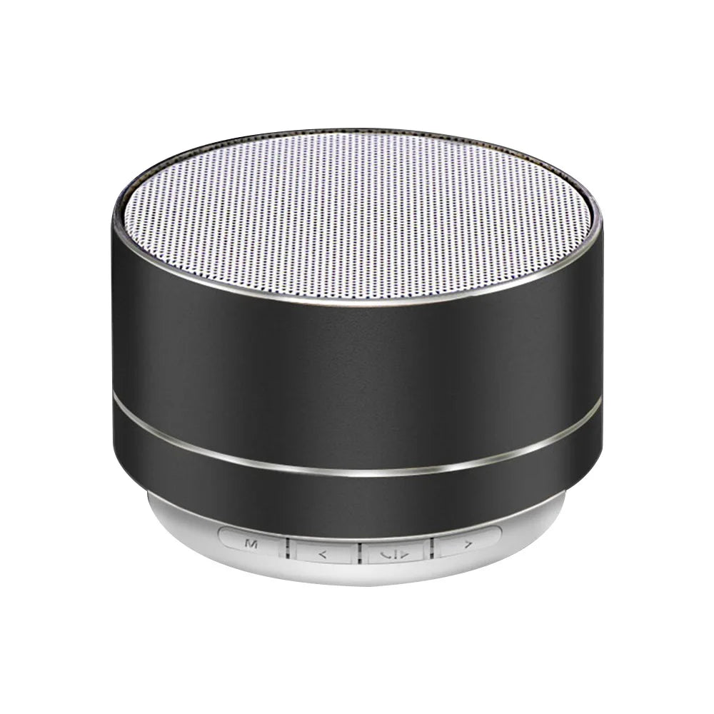 Compact black portable Bluetooth speaker with an aluminium finish, white speaker grille, and integrated base controls.