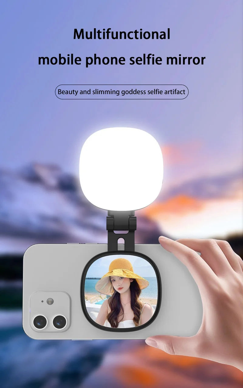 Black clip-on phone accessory with a circular rear-facing selfie mirror and integrated bright LED ring light.