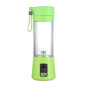 Portable bright green blender with clear cup, metal blades, wrist strap, and power button on the base.