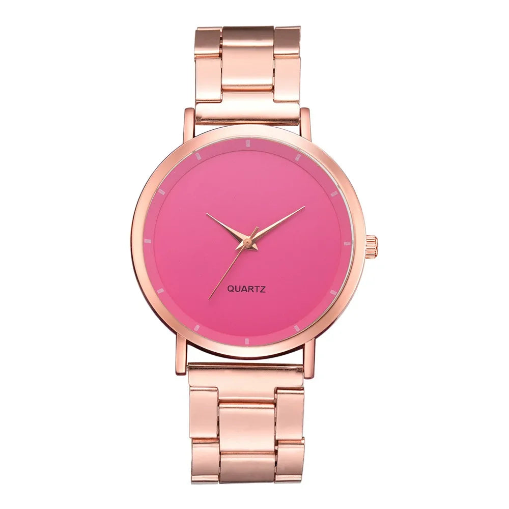 Ladies’ quartz watch featuring a polished rose gold stainless steel link strap and a vibrant pink round dial.