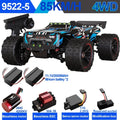 Black and blue 1:16 scale RC monster truck with oversized treaded tires, remote, batteries, and brushless motor.