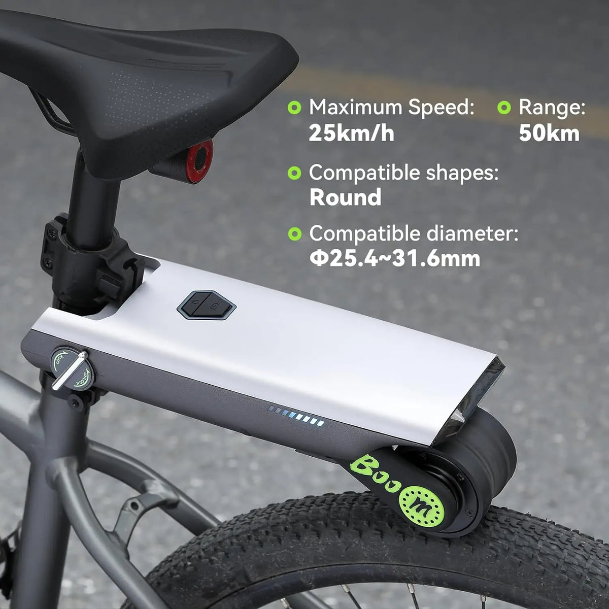 Silver and dark gray electric bike booster mounted below a bicycle saddle, featuring a drive roller touching the rear tire.