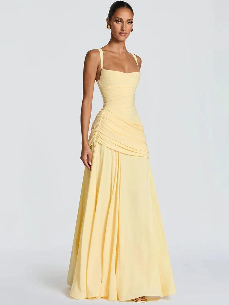 Pale yellow sleeveless maxi dress featuring a square collar, fitted bodice, and ruched hip detailing.