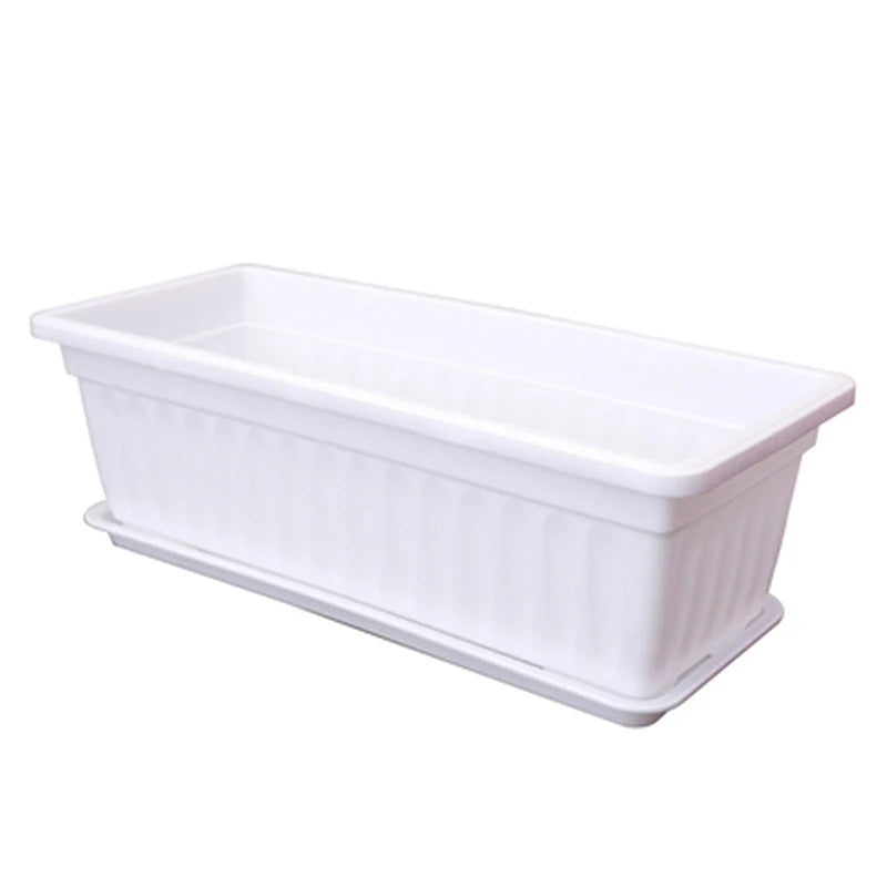 White rectangular plastic planter with a fluted side design and matching bottom drainage tray against a white background.