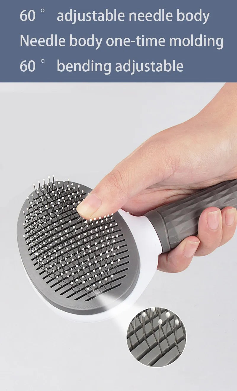 Hand holding a grey and white pet grooming slicker brush with flexible, adjustable wire bristles.