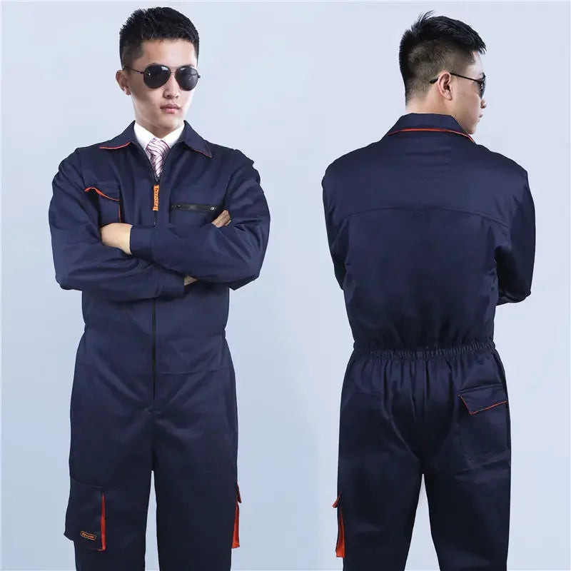 Front and back view of a navy blue cotton work coverall with zip closure, multiple pockets, and orange trim.