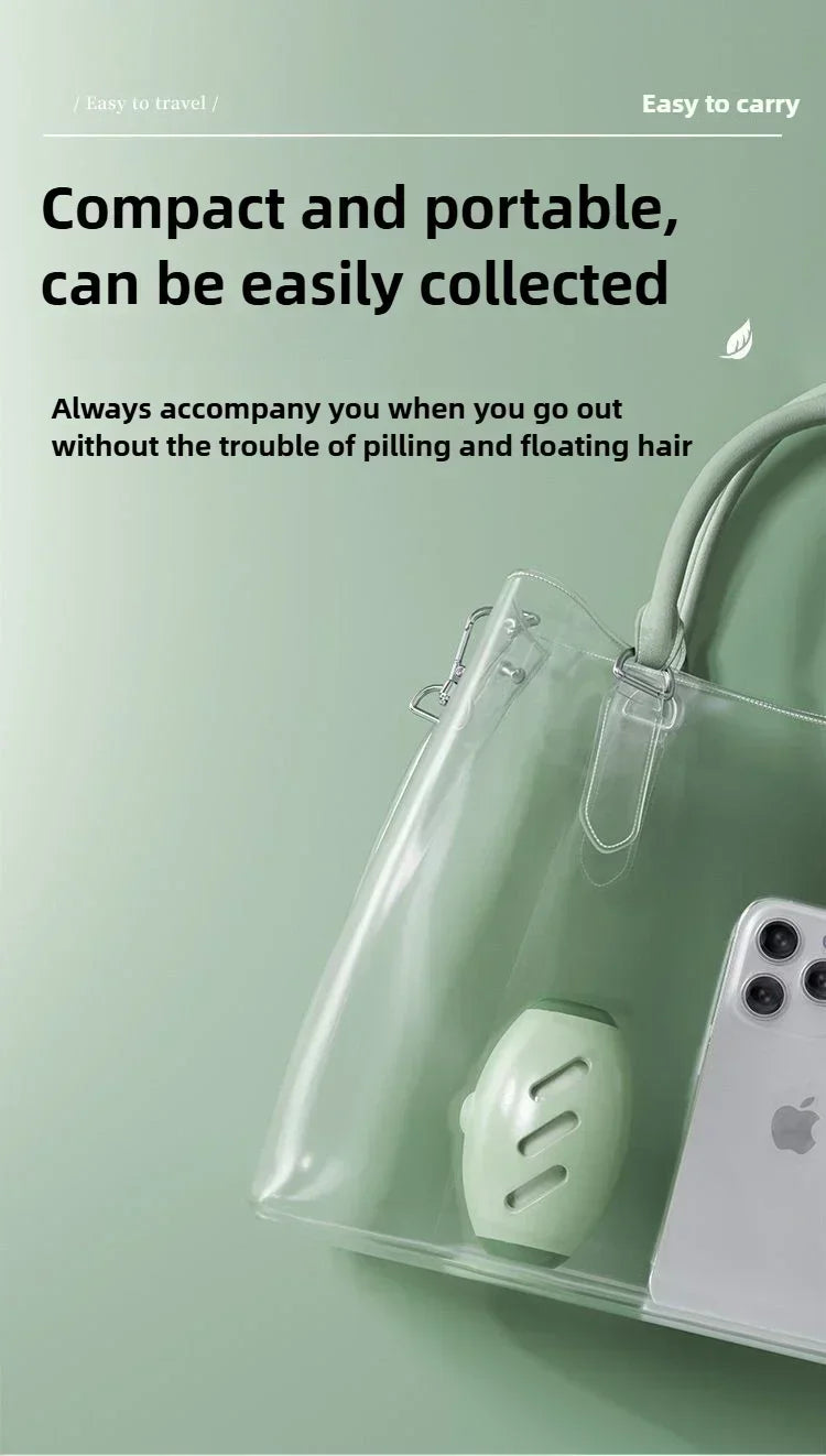 A sage green portable lint remover inside a transparent tote bag next to a smartphone.