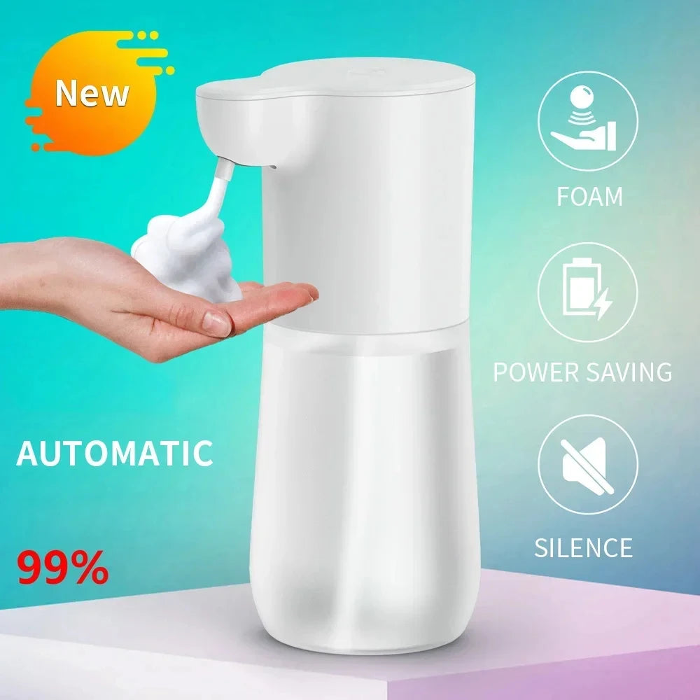 White, touchless automatic foam soap dispenser dispensing foam into a hand. Minimalist design with a clear base.
