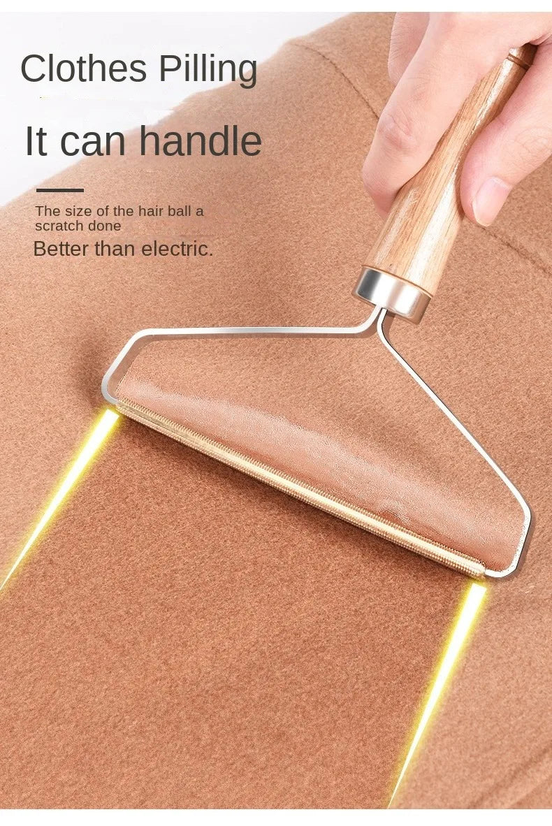 Handheld fabric shaver with a wooden handle being used to remove pilling from a brown wool garment.