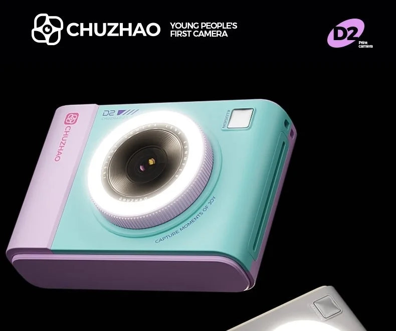 Turquoise and light purple plastic instant print camera with a built-in circular ring light lens.