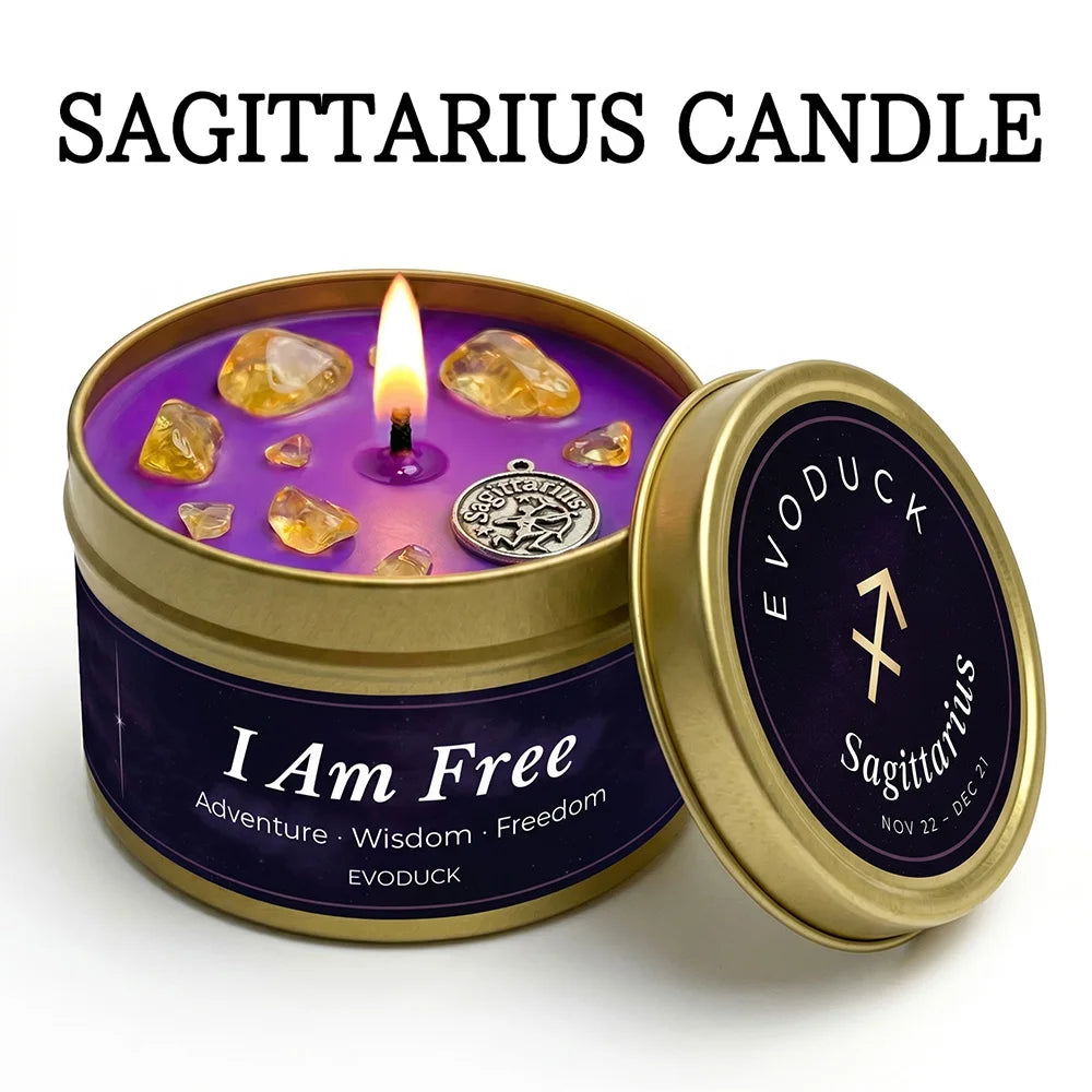 Sagittarius zodiac candle in a gold tin with purple wax, lit wick, yellow crystals, and a silver charm.