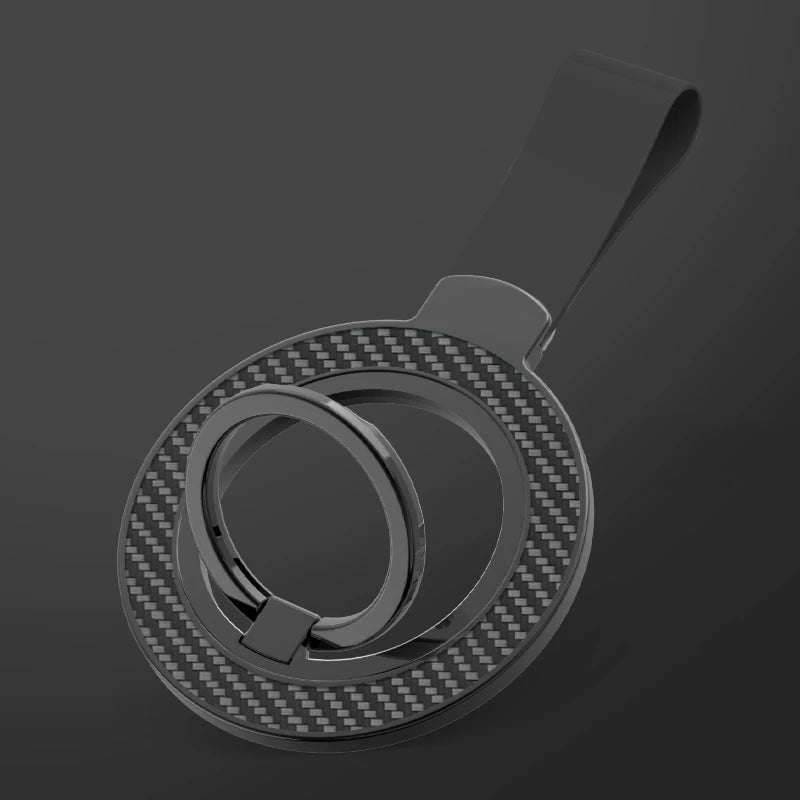 Black carbon fiber style magnetic phone ring holder with a strap attachment on a dark grey background.