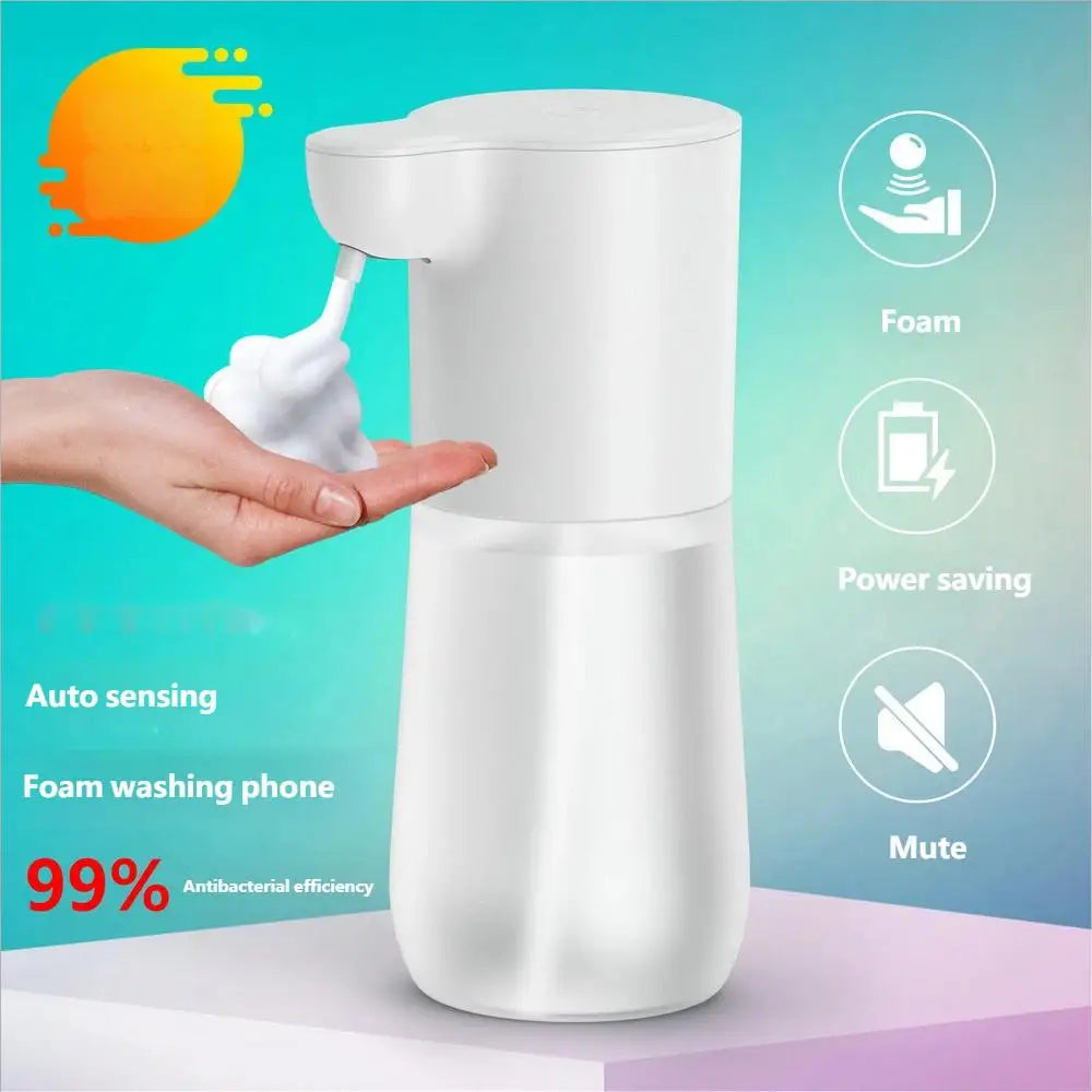 White automatic touchless foam soap dispenser on a stand, dispensing soap onto a hand. Includes icons for key features.